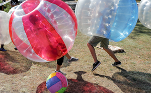 People playing bubble soccer