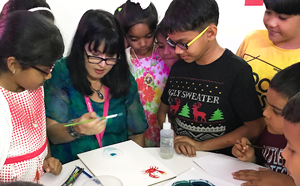 Women and children doing painting