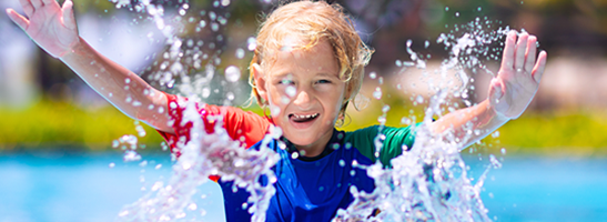 Child playing in a pool